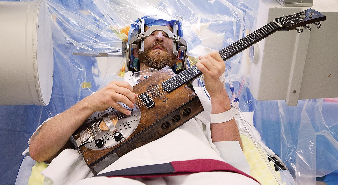 Man Playing Guitar While Having Brain Surgery